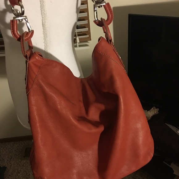 BCBGMaxAzria Handbags - I would call this color a coral red.